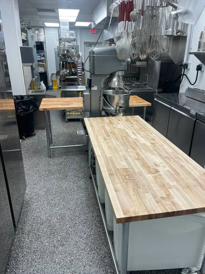 Butcher-block worktable assembled in a commercial kitchen