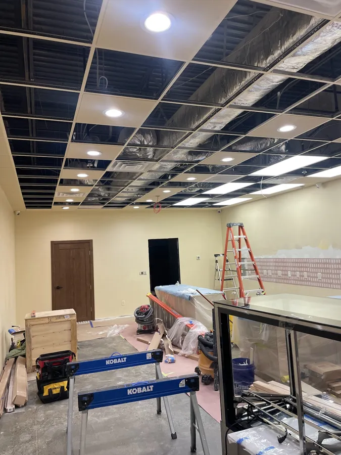 Drop ceiling grid and lights going into a commercial space during a build-out