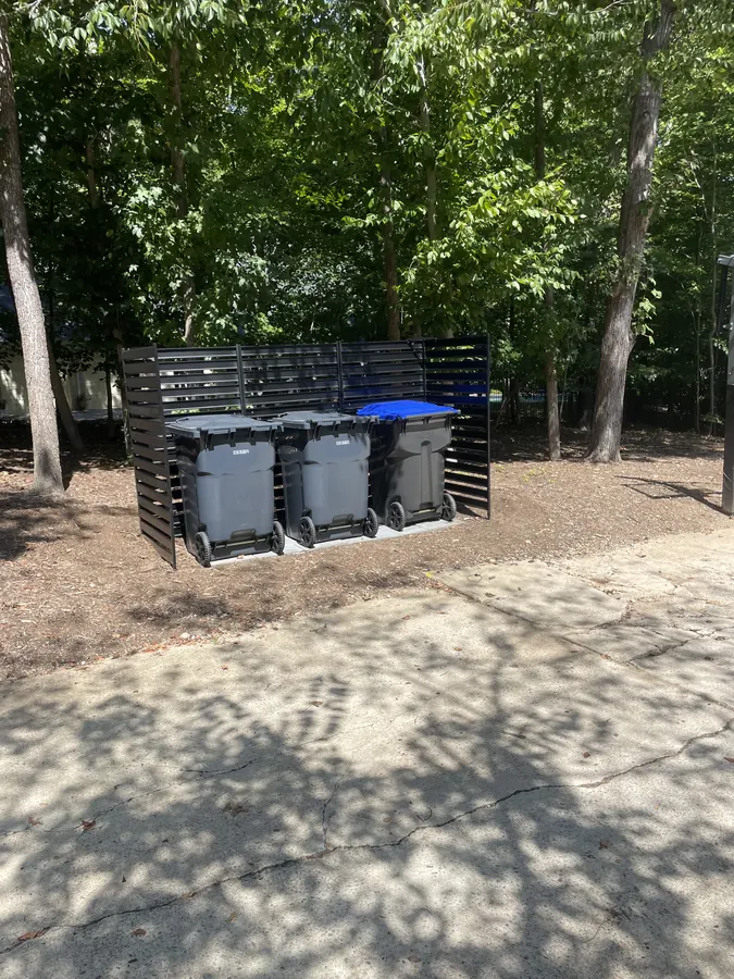 Custom slat trash can enclosure built by Triangle Handyman