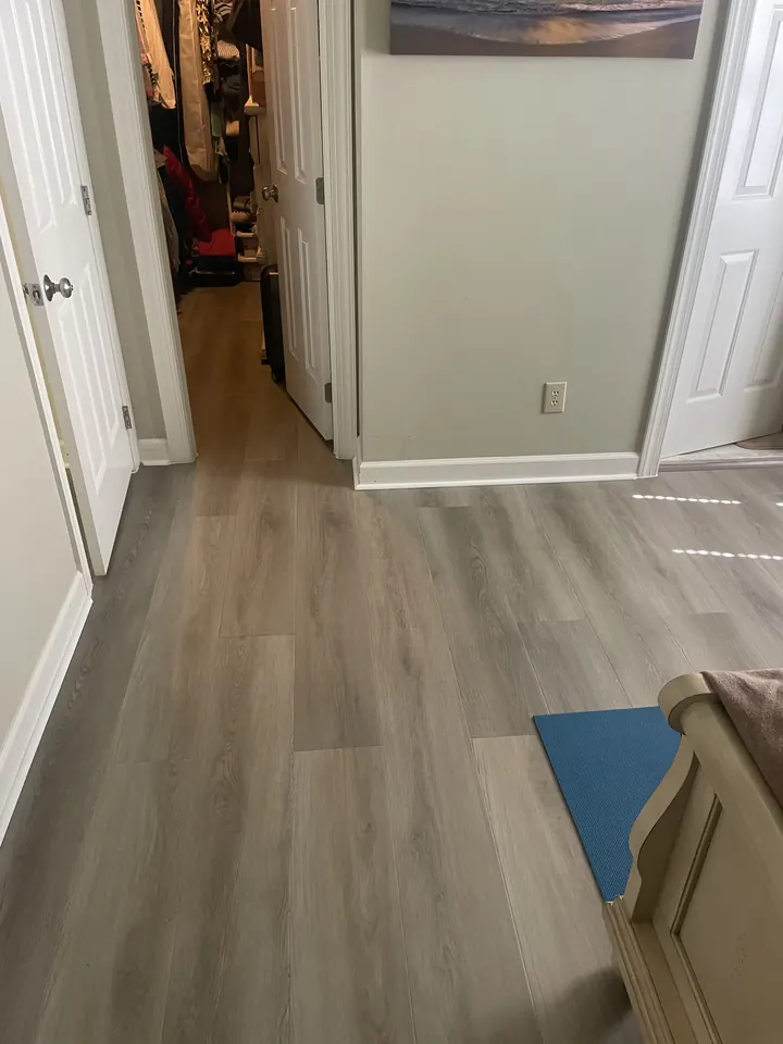 The same hallway with new gray plank flooring