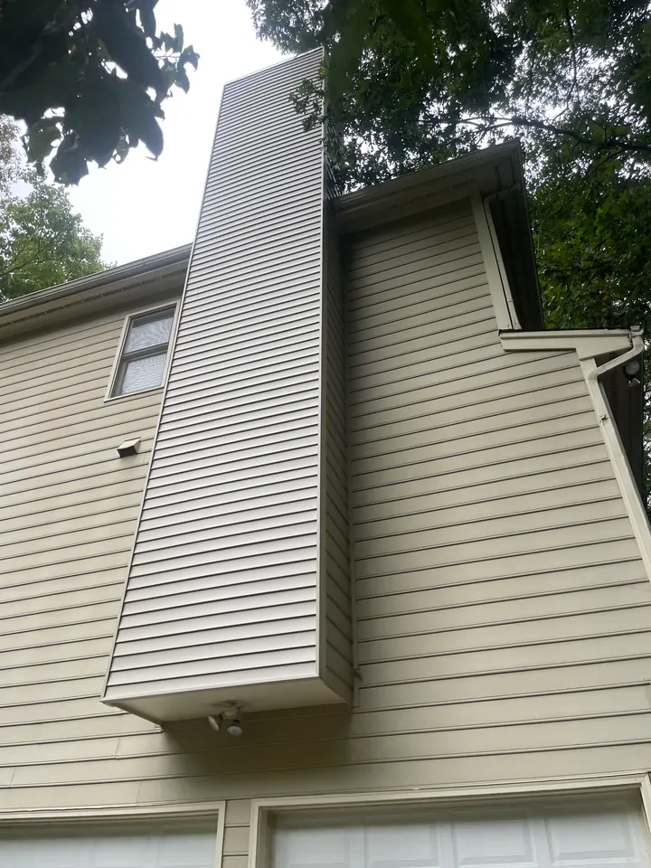 The chimney chase after new siding was installed